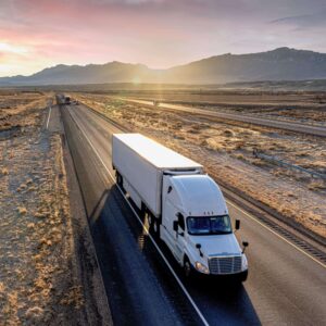 Dedicated truckload shipping on semi-truck driving on the highway